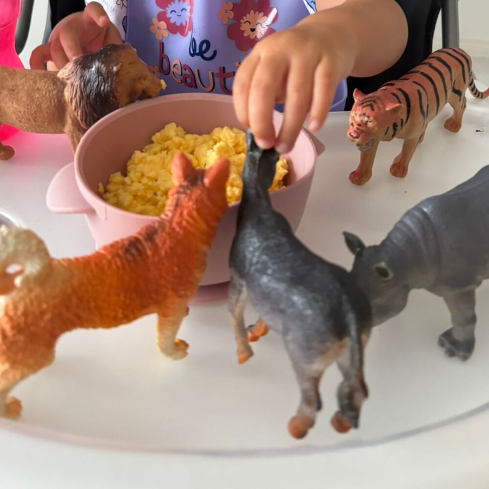 Animal small-world play around a breakfast bowl